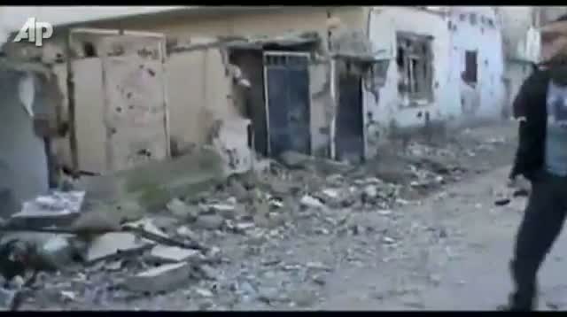 Watch Syrians Fire on Protesters Near Monitors Video