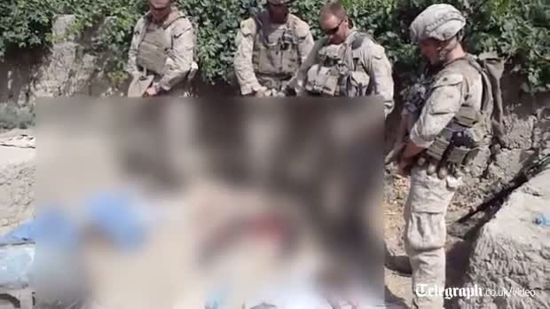 Watch US military investigate video in which marines urinate of dead bodies of Taliban fighters Video