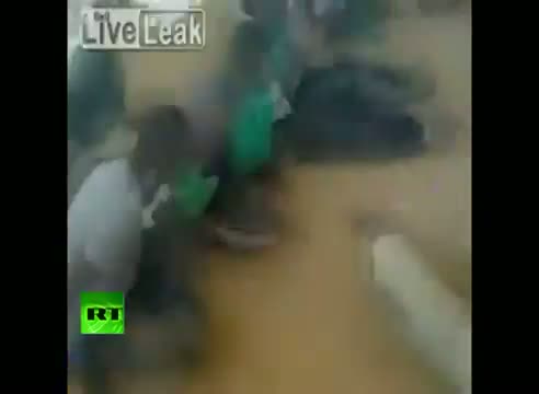 Watch Shocking video - Libyan rebels cage black Africans, force-feed them flags Video
