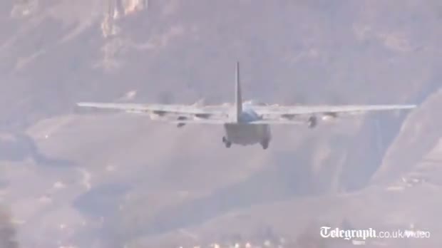 Watch Bodies of Swiss crash victims flown back to Belgium Video
