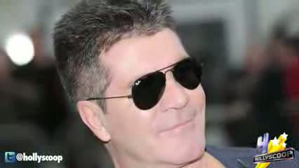 Watch Woman Breaks Into Simon Cowell's House with Brick video Video