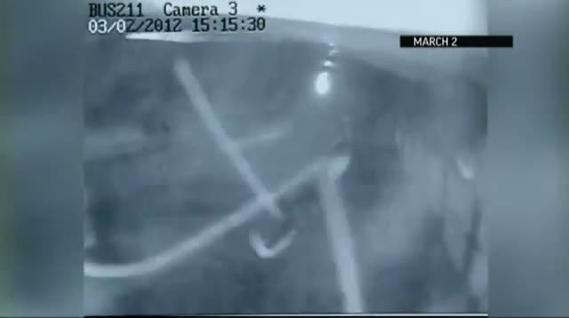 Watch Raw Video - Tornado Hits School Bus Video