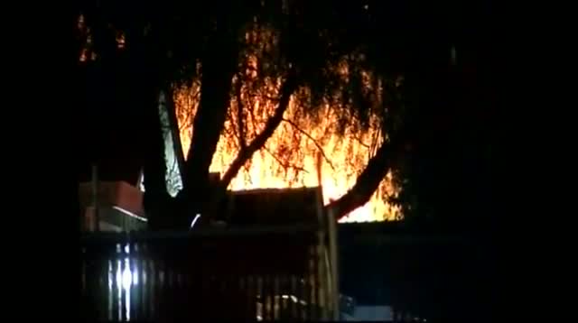 Watch Raw Video - Flames Seen Near Calif. Standoff Video