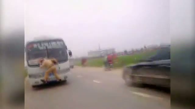Watch Vietnam - Cop Gets Wild Ride on Front of Bus video Video