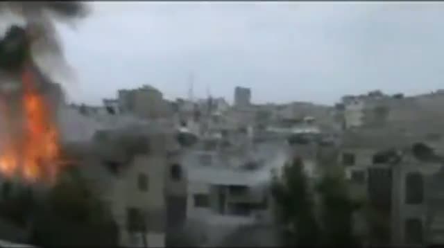 Watch Raw Video - Syrian Troops Continue Homs Shelling Video