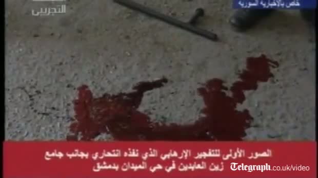 Watch Syrian TV airs bloody aftermath of Damascus suicide bomb Video