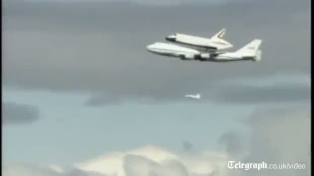 Watch Space shuttle in Statue of Liberty flypast Video