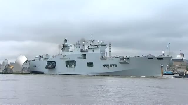 Watch HMS Ocean sails through the Thames Barrier to Greenwich Video