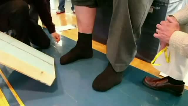 Watch America's tallest man gets new size 21 shoes Video