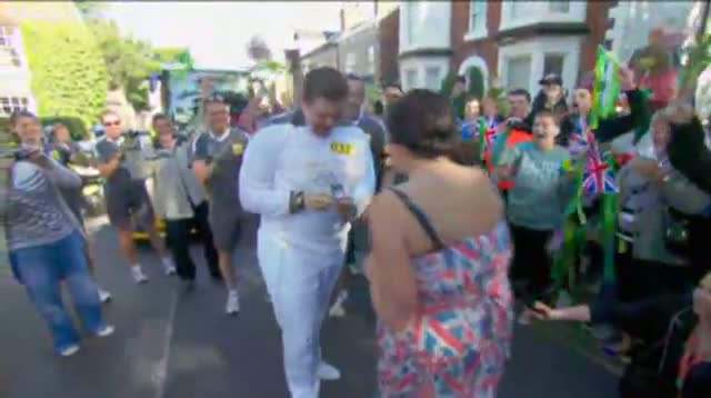 Watch Olympic Torch Bearer Proposes to Girlfriend Video