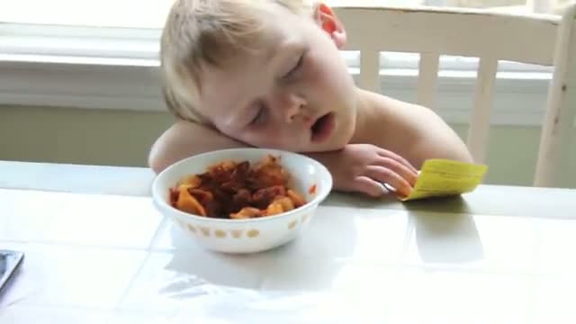 Watch Boy Sleeping at Dinner Table after First Day of School Video