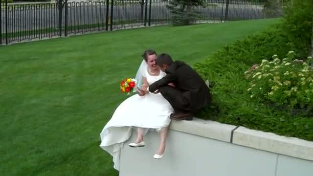 Watch Bride and Groom fall in bushes! Too funny! Video