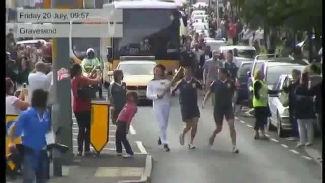 Watch Man tries to Grab Torch during Olympic Relay Video