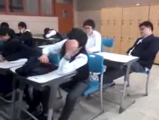 Watch Hilarious slapping prank on sleeping student Video