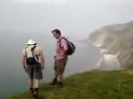 Watch Man Falls Down Cliff Video