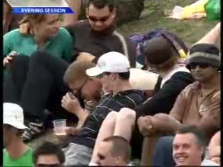 Watch Drunk cricket fan falls over with drink in hand Video