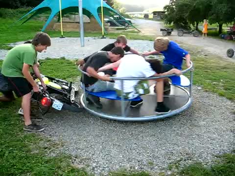 Watch Spinning a carousel with a moped Video