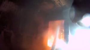 Watch Firefighter with helmet cam putting out house fire Video