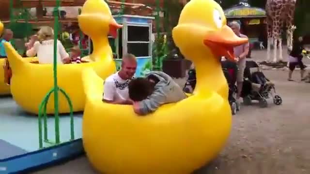 Watch Two guys break children's duck ride Video