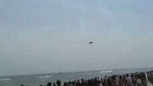 Watch FA-18 breaks sound barrier above beach crowd Video