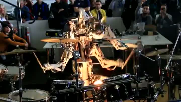 Watch 4 Armed Mohawked Robot playing the drums Video