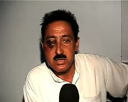 Watch J&K minister's guards held for assaulting traffic cop Video