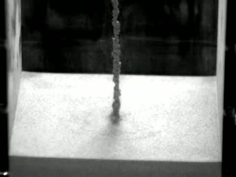 Watch Steel ball drops on fluid-like sand bed Video
