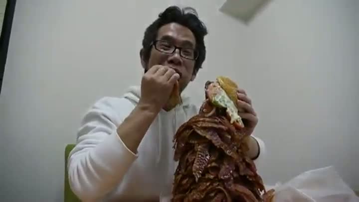 Watch Would You Eat This Burger with Over a Thousand Strips of Bacon? Video