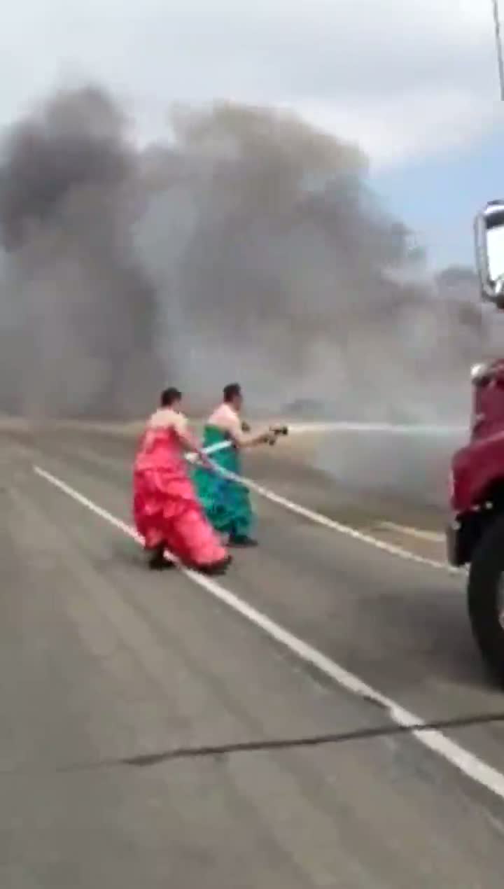 Watch Firemen in Drag Put Out Truck Fire Video