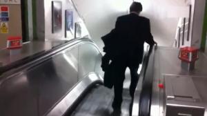 Watch Drunk Business Man Vs Escalator Video