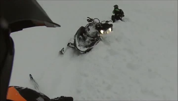 Watch Snowmobiler Is Buried By Avalanche, Quickly Saved Video