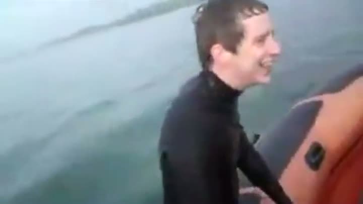 Watch Guy's "Friends" Push Him Into Water With Shark Nearby Video