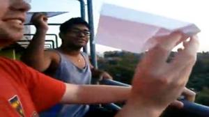 Watch Man Wills Paper Airplane Into Trash Bin Video