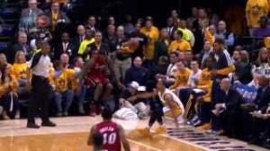 Watch NBA: LeBron James falls into Shaq's lap! Video