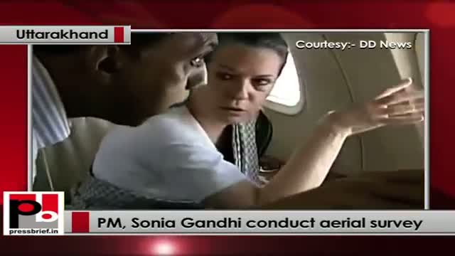 Watch PM, Sonia Gandhi conduct aerial survey of flood-hit U'khand; Rs. 1,000 cr relief announced Video