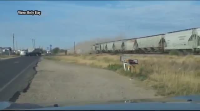 Watch Train Hits Tractor-trailer Stuck on Tracks Video
