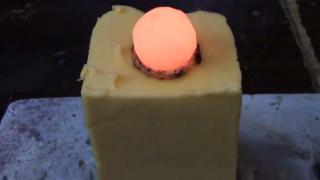Watch Red Hot Nickel Ball Dropped On a Block of Velveeta Cheese Video