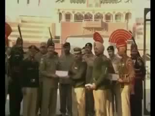 Watch India, Pakistan Army Soldiers Exchange Sweets at Wagah Border on 65th Republic Day 2014 Video Video
