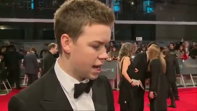 Watch BAFTAs 2014 Will Poulter interview on the red carpet as he crushes on Leonardo DiCaprio Video