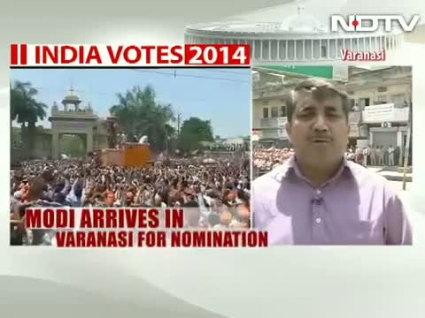 Watch Narendra Modi to file nomination in Varanasi, sea of saffron on streets Video