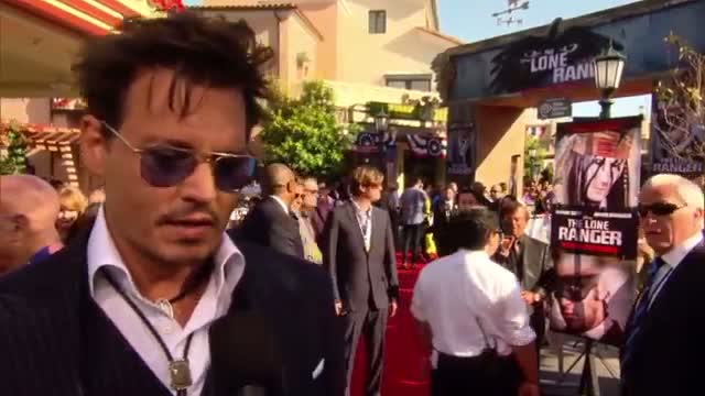 Watch Johnny Depp and Amber Heard Indulge in Erotic Literature Video