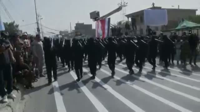 Watch Militiamen Parade in Several Iraqi Cities Video