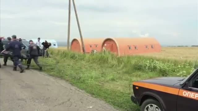 Watch Crews Begin Moving Bodies at Jet Crash Site Video