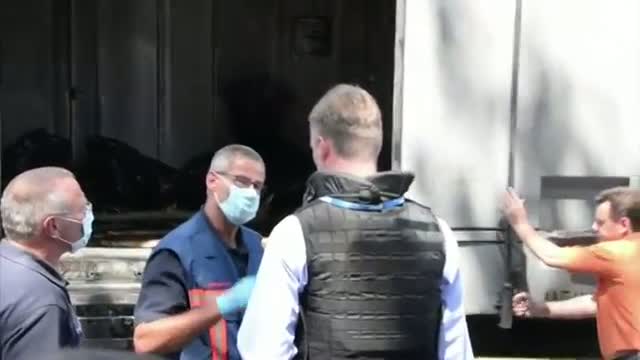 Watch International Team Inspects MH17 Bodies Video