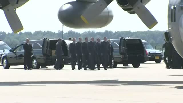 Watch MH17 Victim's Bodies Arrive in Netherlands Video
