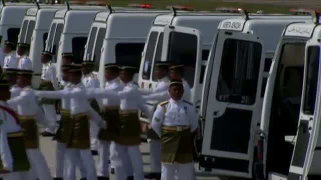 Watch Bodies of MH17 Victims Arrive in Malaysia Video