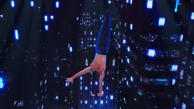 Watch Christian Stoinev: Hand-Balancer Plays With Puppy - AmericaÃ¢â‚¬â„¢s Got Talent 2014 Video