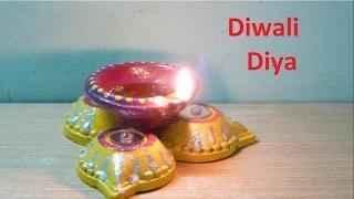 Watch How to make decorated Diwali Diya (oil lamp) from old or previous years used diya Video