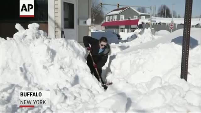 Watch Snow Piled High, Buffalo Faces Flooding Video