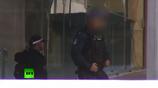 Watch Sydney Siege: Gunman takes hostages in Lindt Chocolate cafÃƒÂ©, area on police lockdown video Video